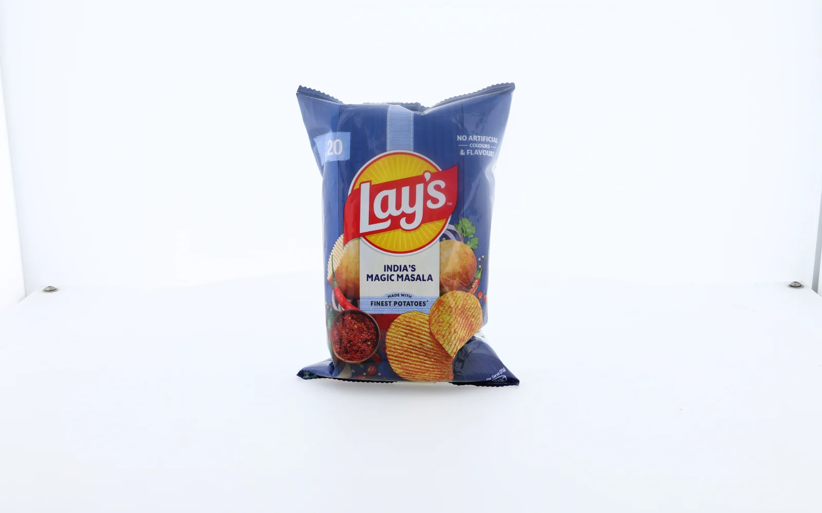A blue Lay’s packet standing upright on the turntable, front label facing the camera