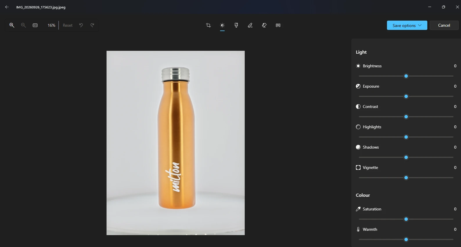 A product photo of a copper water bottle open in a photo editor, ready to be adjusted and saved