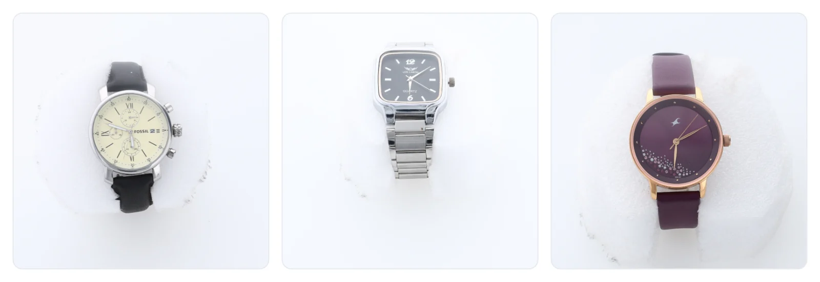 Three watches photographed in the same studio session and framed the same way: a chronograph, a steel watch and a plum watch