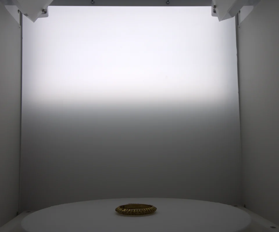 The back door light lighting the backdrop as a gradient behind a bangle