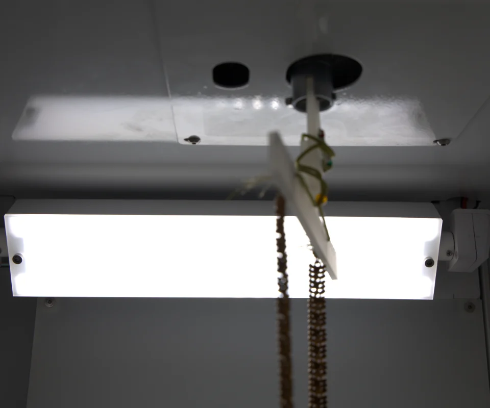 A key light panel above a gold necklace hanging in the EasyCLIQ X3
