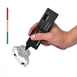 A handheld diamond tester checking the stones on a ring
