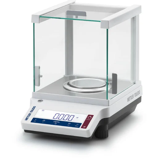 A precision balance with a glass draft shield